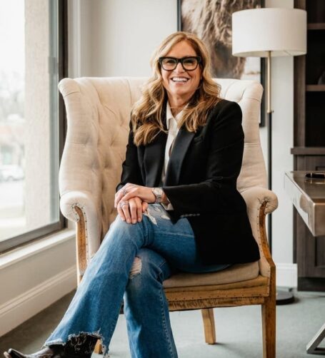 Susan Filan seated in an armchair