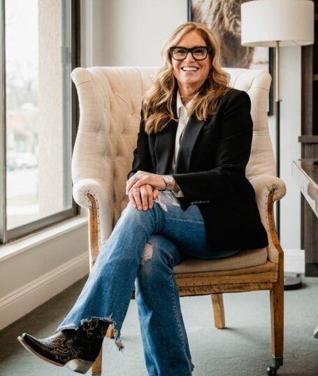 Susan Filan seated in an armchair